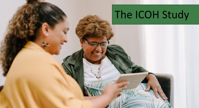 Two women talking and using an ipad